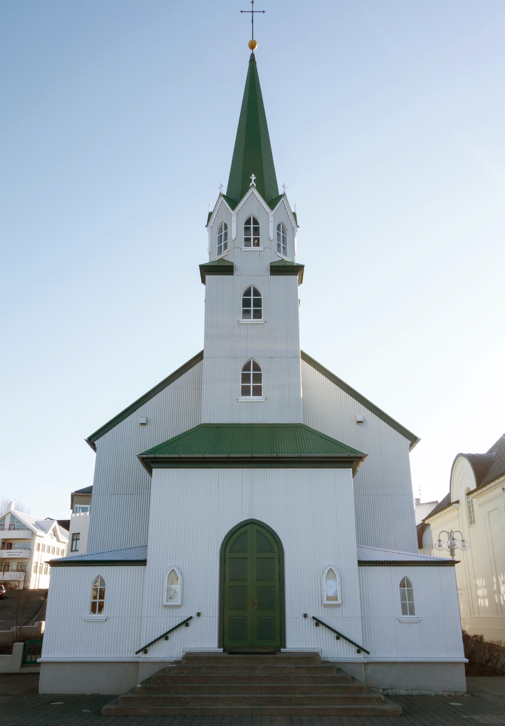 Front view of Fríkirkjan Church in Reykjavík with its green-roofed tower.