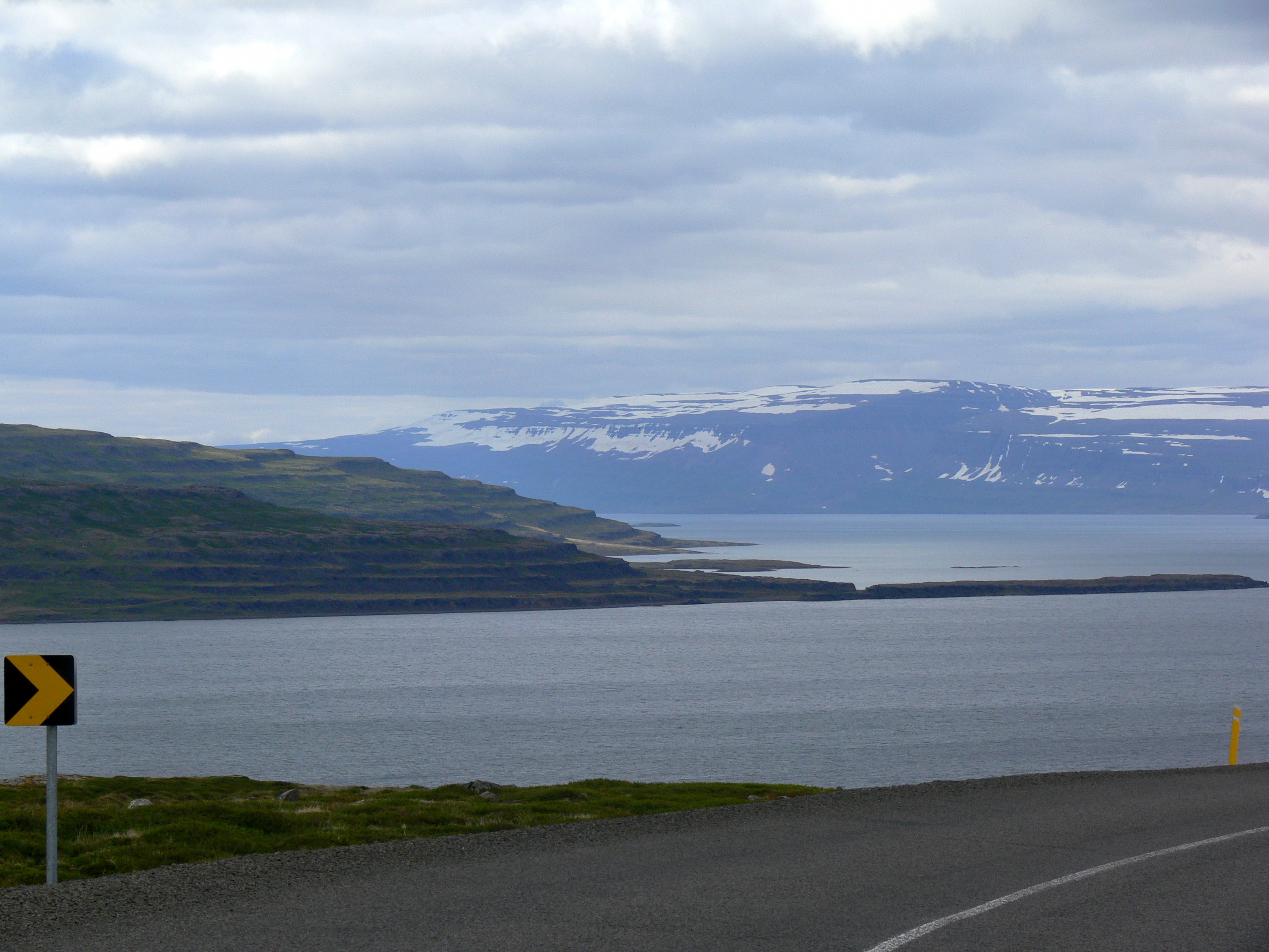 Shoreline and open water in Mjóifjörður, the fjord landscape around the Hörgshlíðarlaug detour.