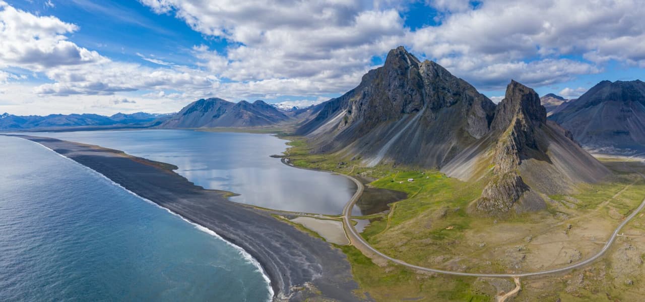 Aerial view of the Hvalnes peninsula, black pebble shoreline, Route 1, and Eystrahorn in East Iceland.