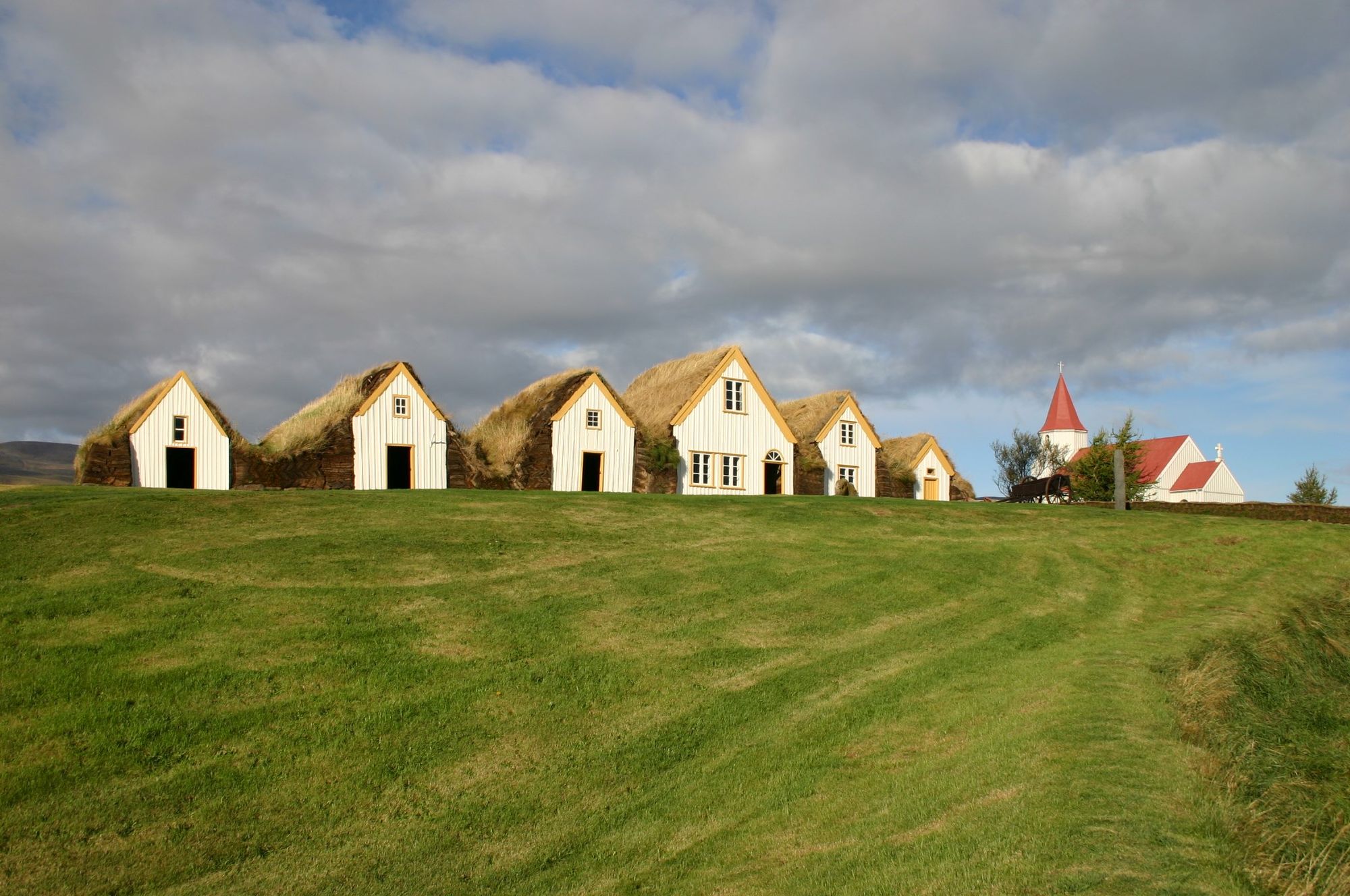 Glaumbær turf farm buildings in Skagafjörður as a nearby heritage pairing.