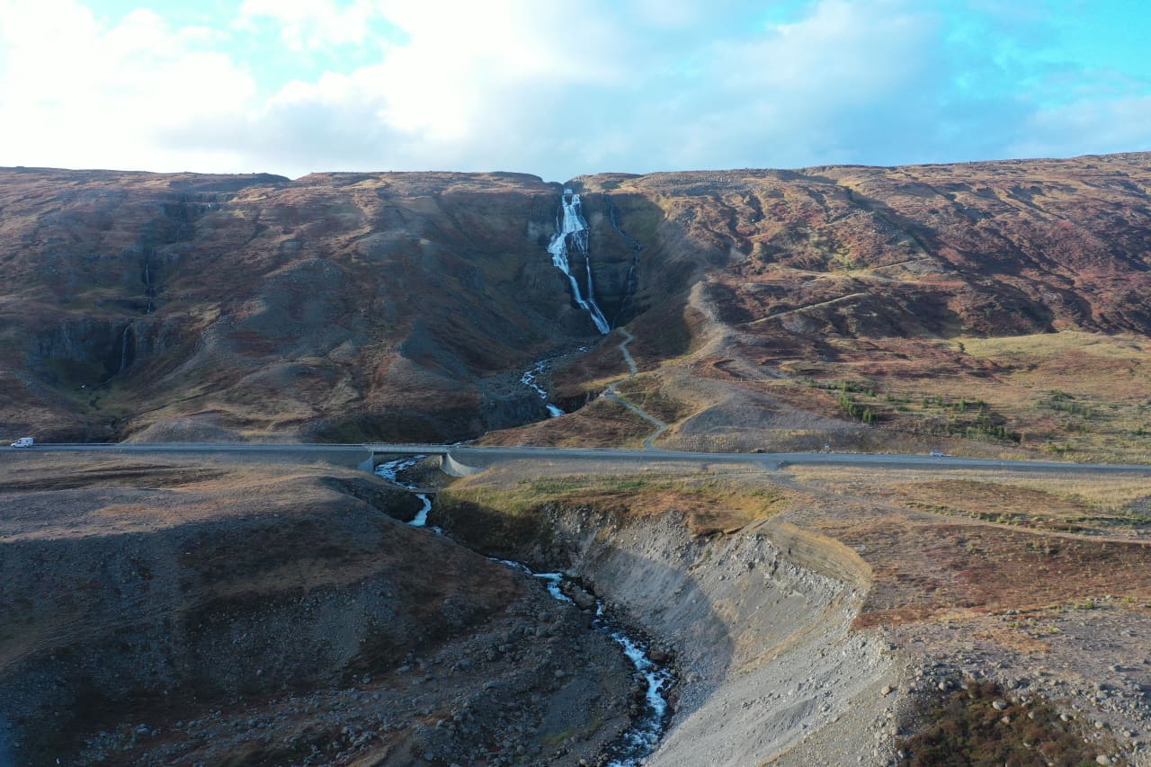 Rjúkandi Waterfall running down a broad East Iceland slope above the Jökuldalur road corridor.