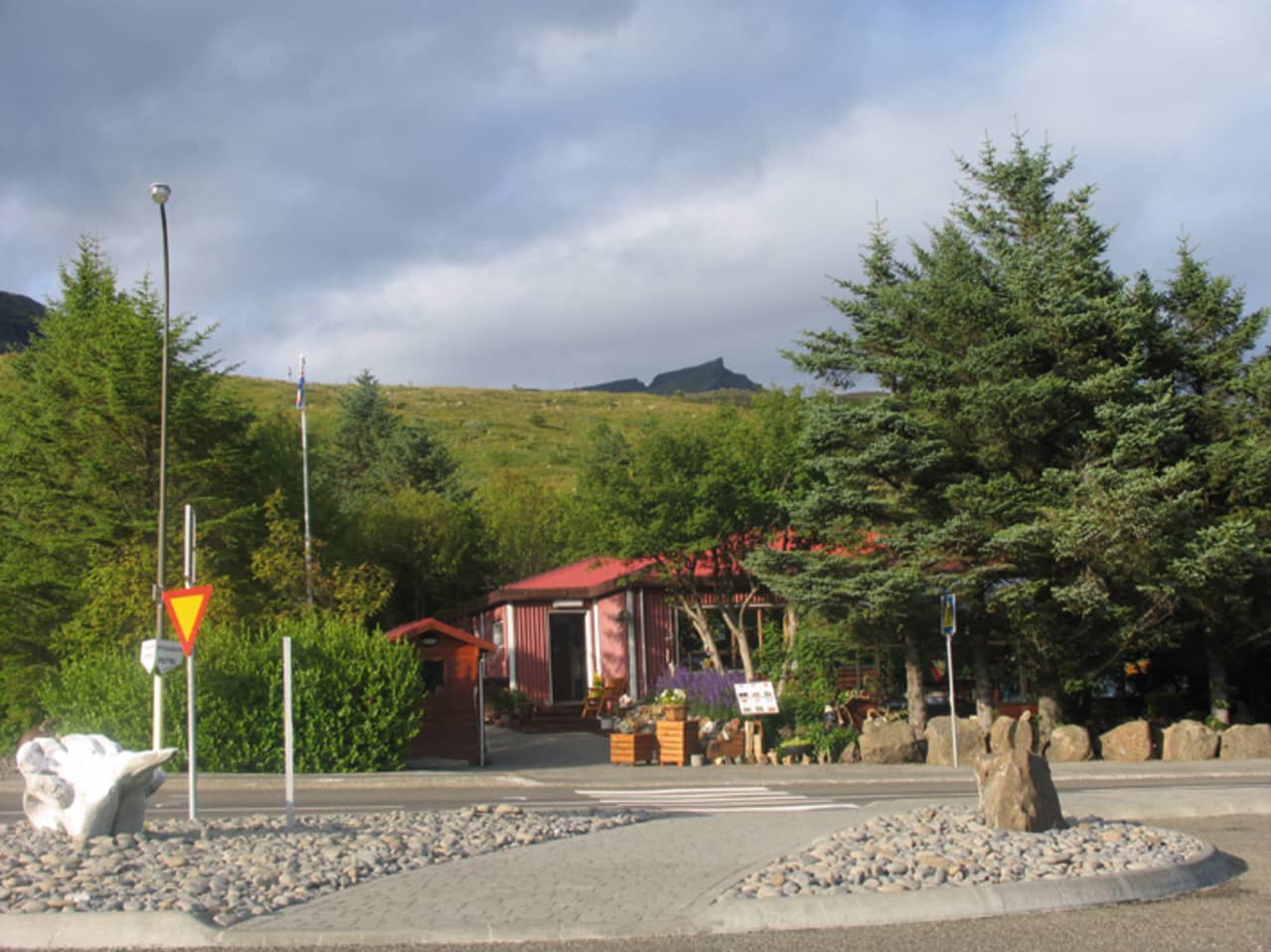Exterior view toward Petra's Stone Collection in Stöðvarfjörður with the museum building tucked into the hillside.