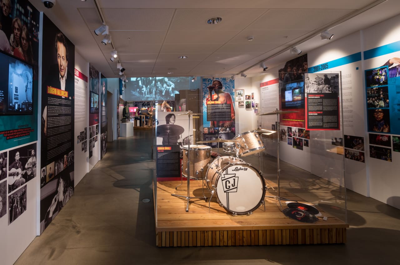 Exhibition hallway and drum display inside the Icelandic Museum of Rock 'n' Roll.