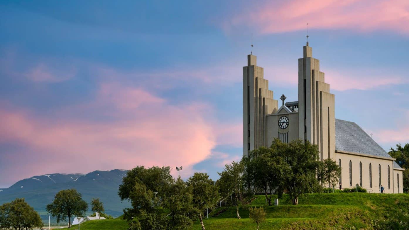 Akureyrarkirkja on its hill above Akureyri with mountains behind