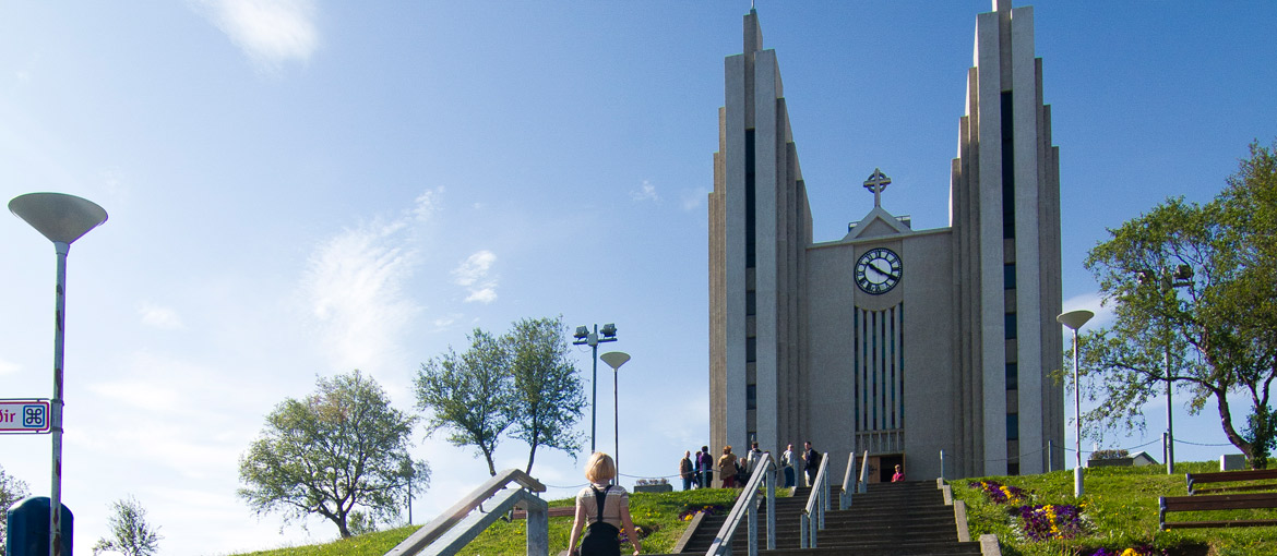 Akureyrarkirkja above its stairway on a sunny day in Akureyri