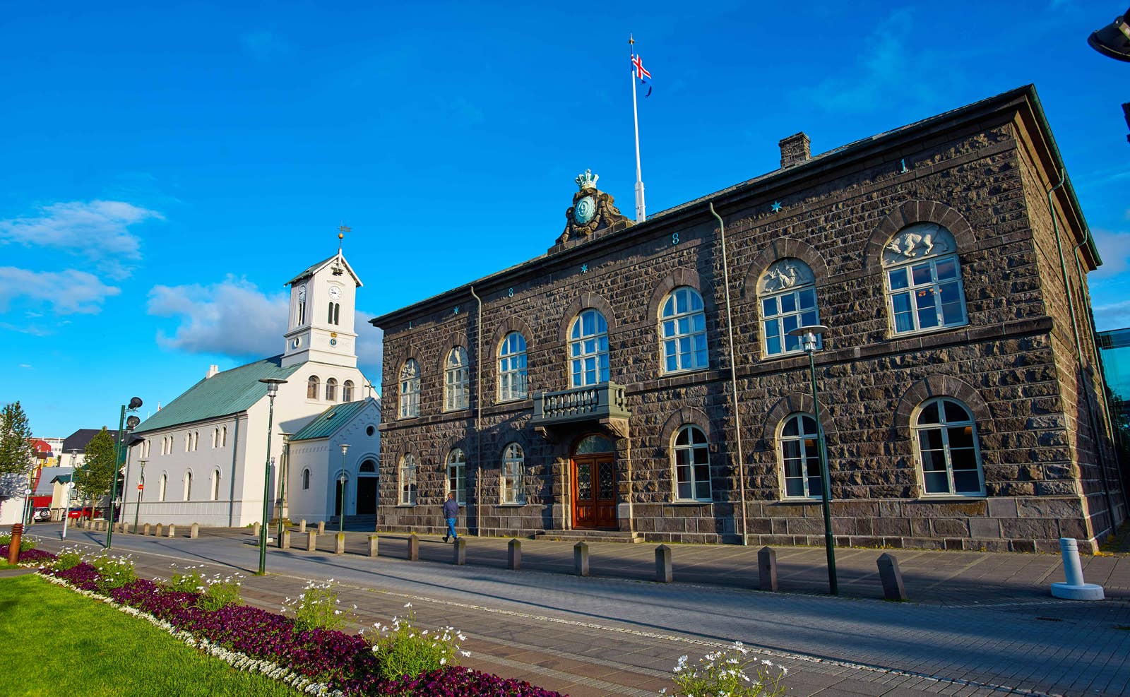 Alþingi Parliament House beside Dómkirkjan on a sunny day in Reykjavík