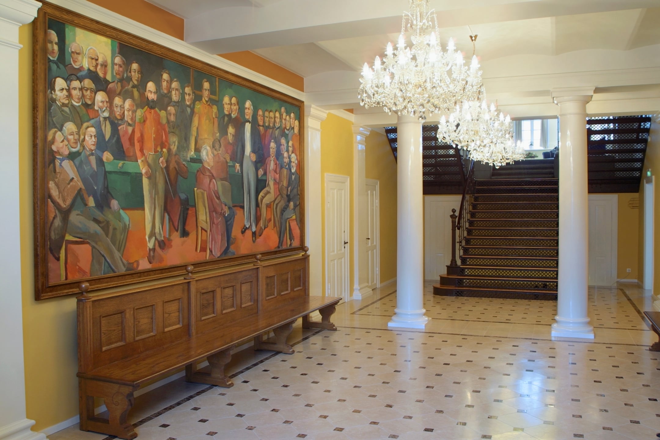 Entrance hall inside Alþingi with staircase and historical painting