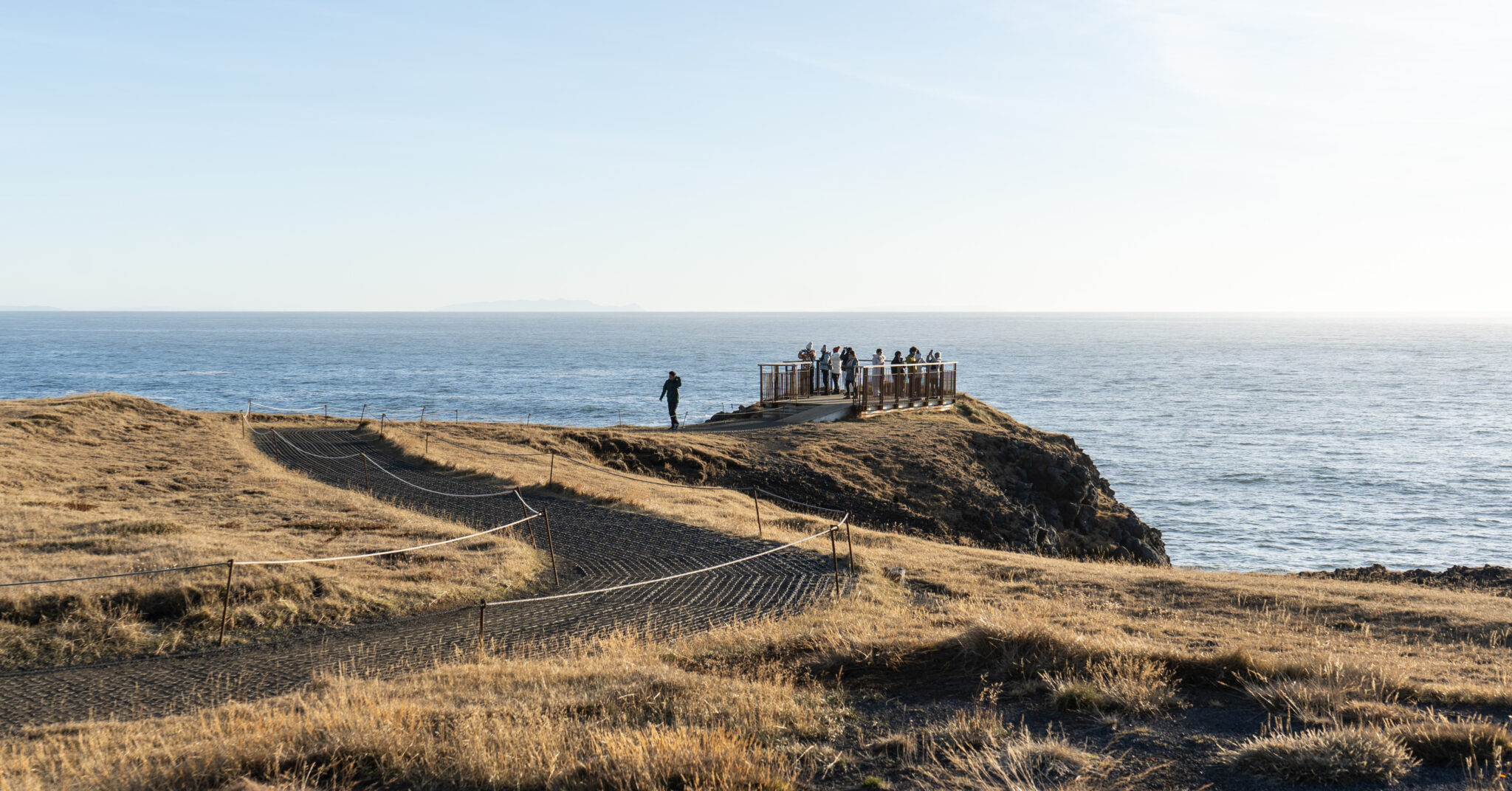 Marked coastal walking path near Arnarstapi and Hellnar above the Atlantic cliffs.