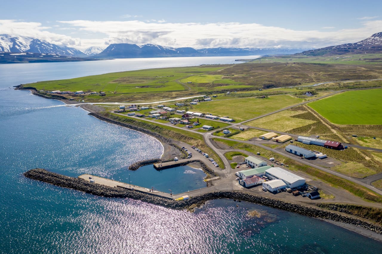 Aerial view of Árskógssandur harbor and village beside Eyjafjörður
