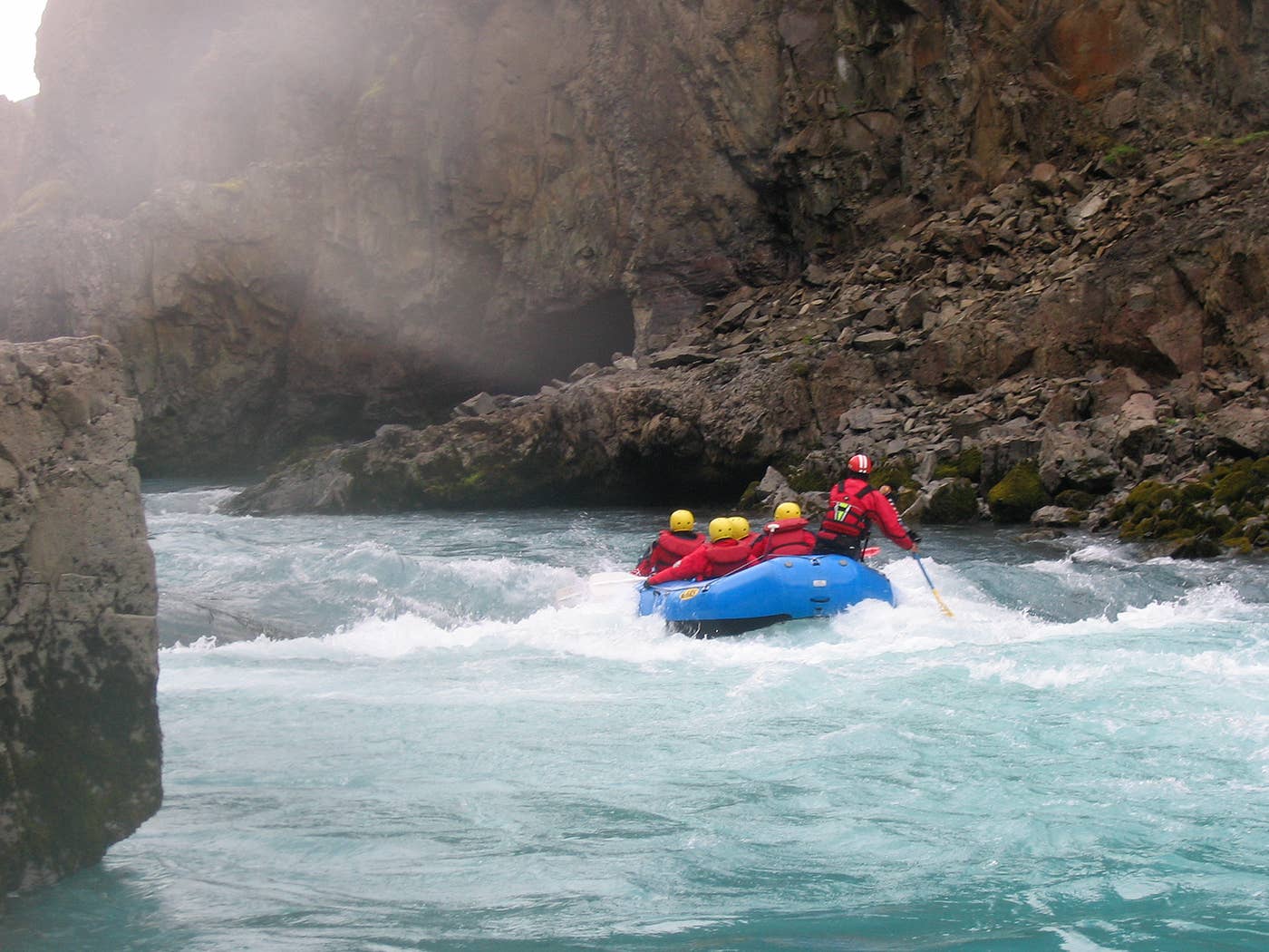 Raft moving through the blue-white Austari-Jökulsá gorge near Austurdalur.