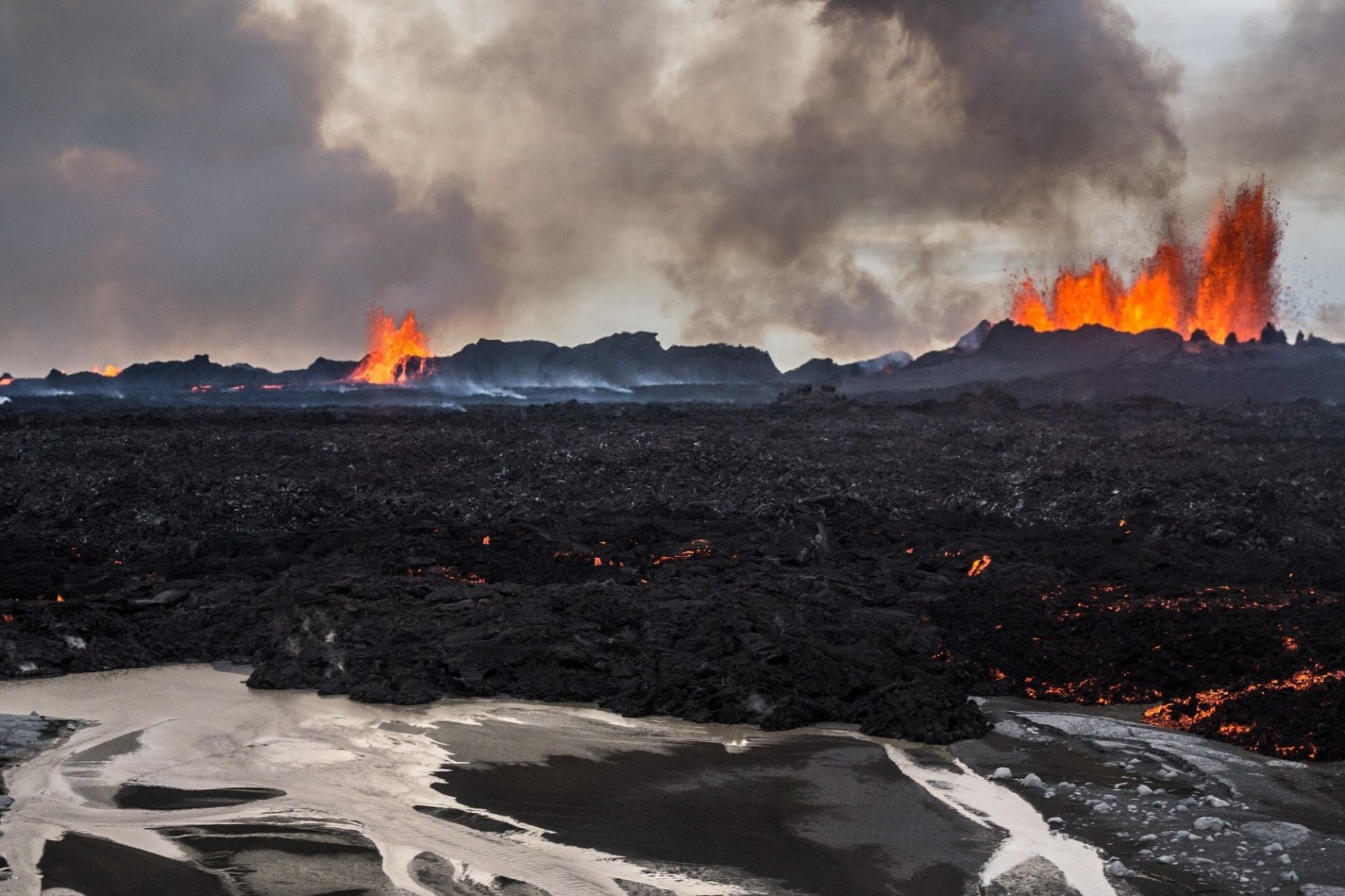 Lava fountains and black new lava at Holuhraun during the Bárðarbunga volcanic episode.