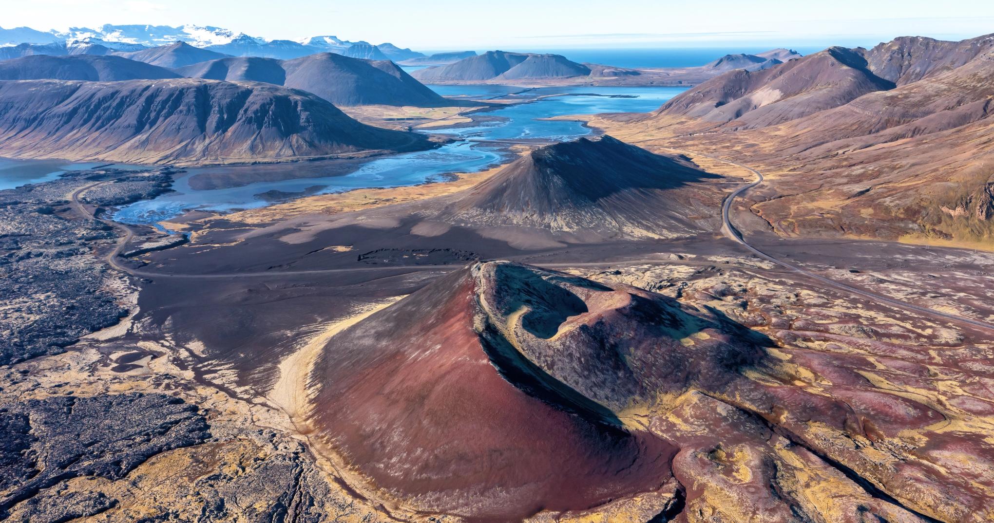 Aerial view of Berserkjahraun lava field, red scoria craters, lakes, and the north Snæfellsnes road.