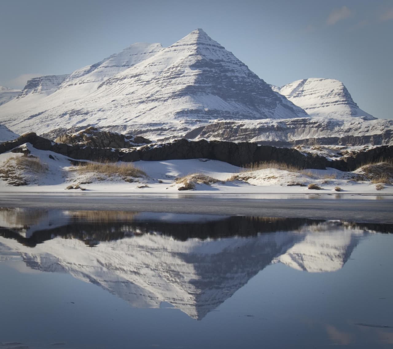 Búlandstindur reflected in still water near Djúpivogur on the south side of Berufjörður.