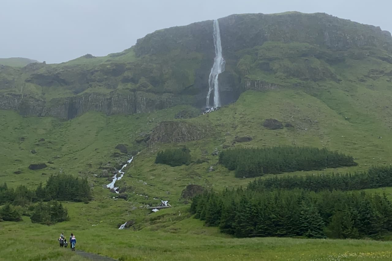 Bjarnarfoss Waterfall dropping above the marked trail on the south side of Snæfellsnes.