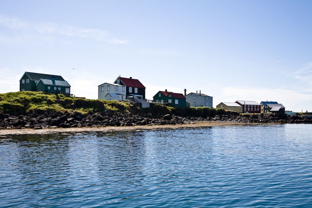Colorful houses along the shoreline on Flatey island in Breiðafjörður.