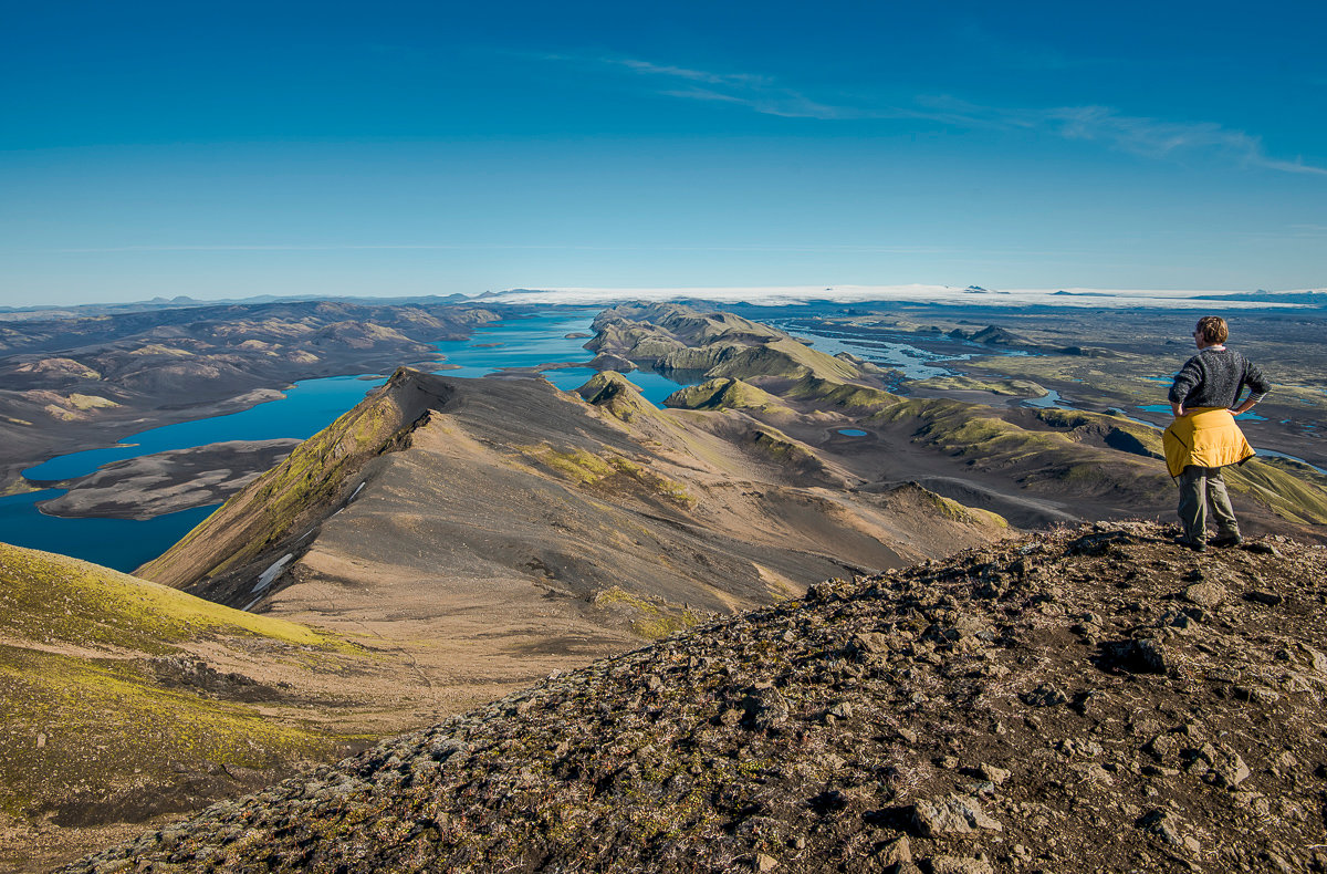 High view over Langisjór, dark highland ridges, and the white edge of Vatnajökull from the Breiðbakur area.