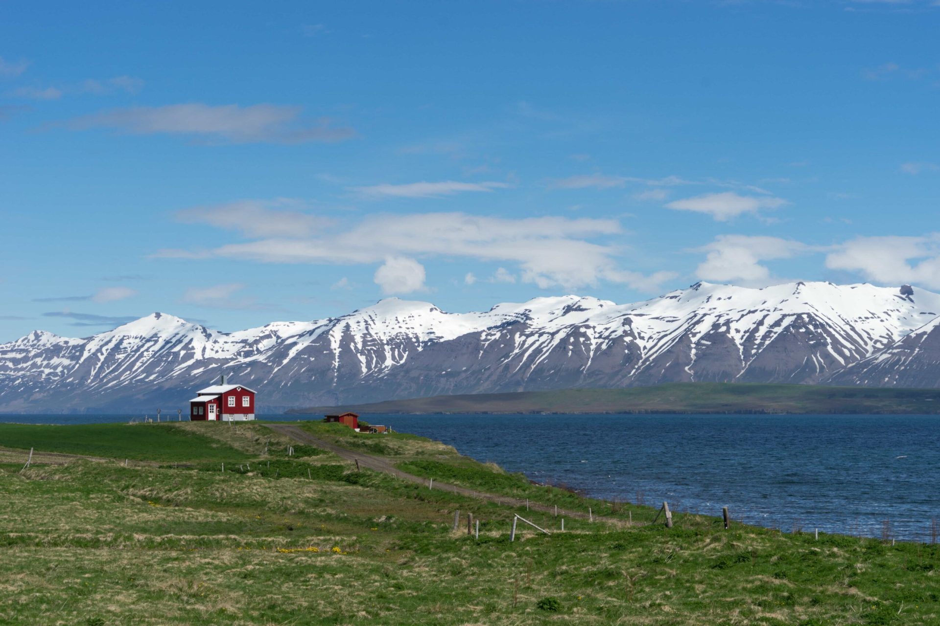 Dalvík town beside Eyjafjörður with North Iceland mountains rising behind the village.