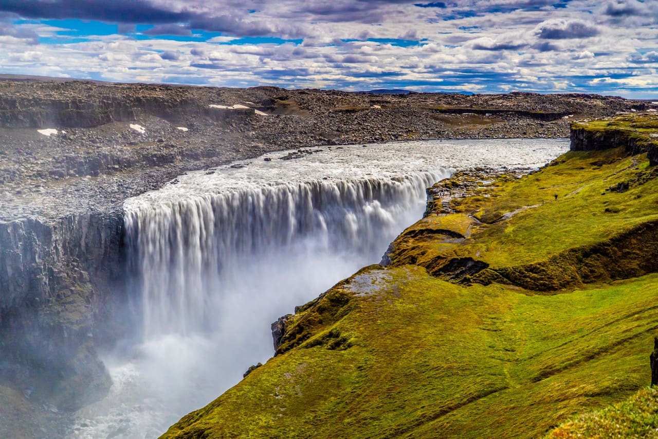 Dettifoss waterfall plunging into Jökulsárgljúfur canyon from the west-side viewpoint in North Iceland.