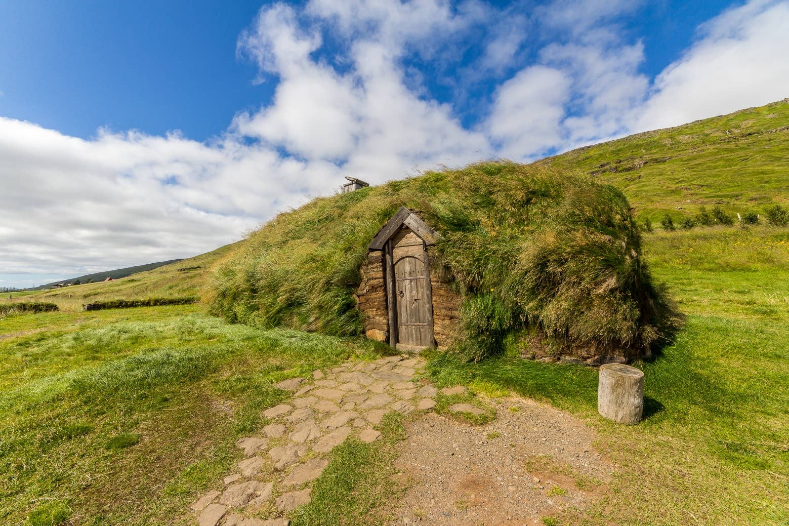 Turf-roofed reconstructed longhouse at Eiríksstaðir in Dalir.