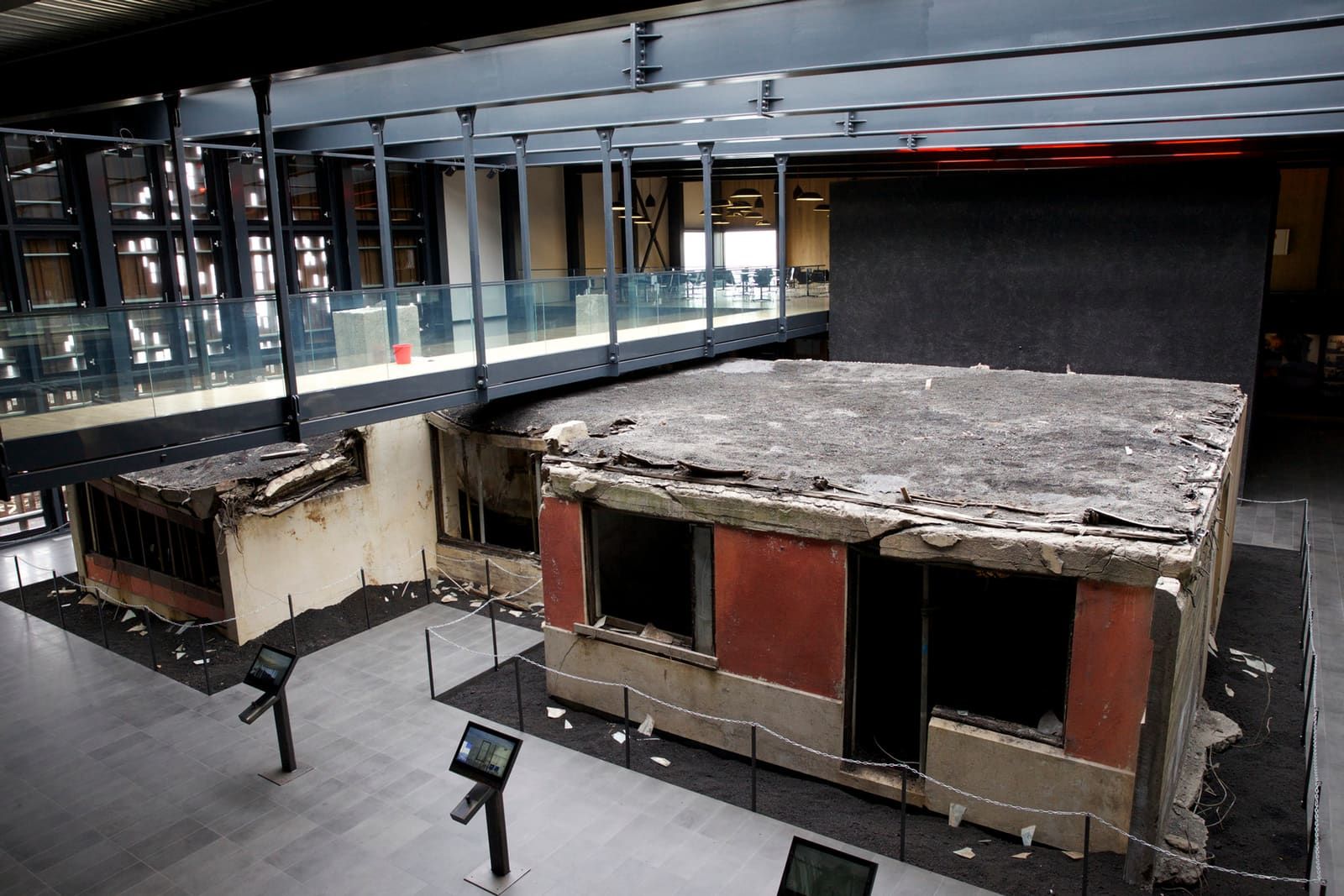 Upper-level view across the preserved house inside Eldheimar Museum on Heimaey.