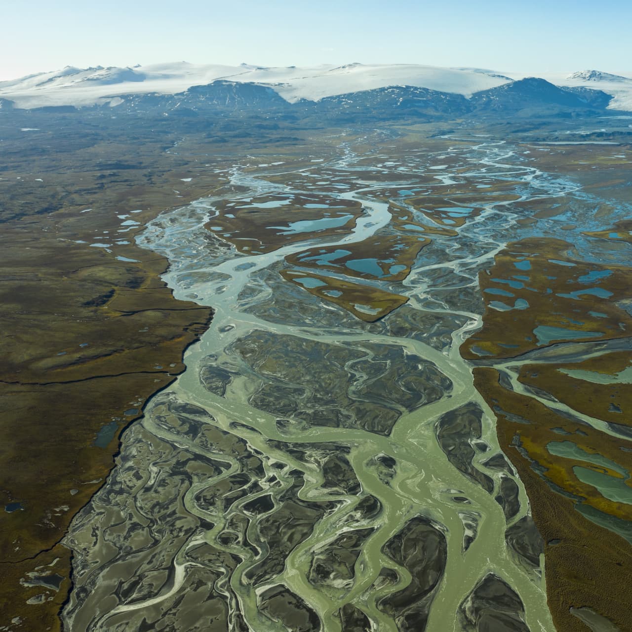Aerial view of braided glacial water and wetland ponds across Eyjabakkar in East Iceland.