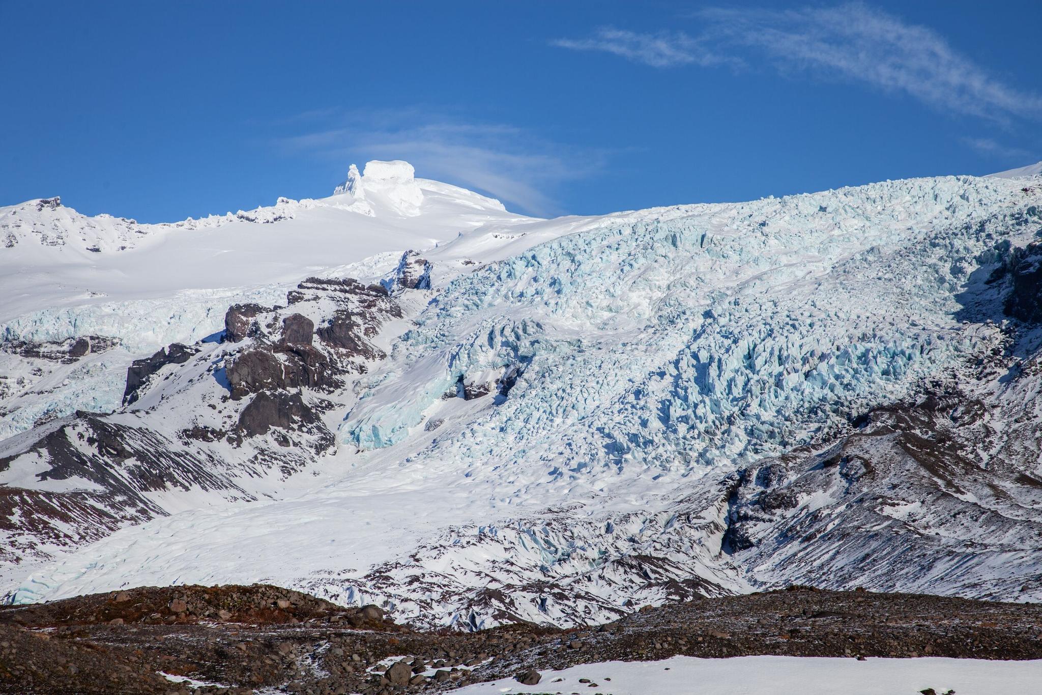 Wide winter view of Falljökull Glacier descending from Öræfajökull in southeast Iceland.