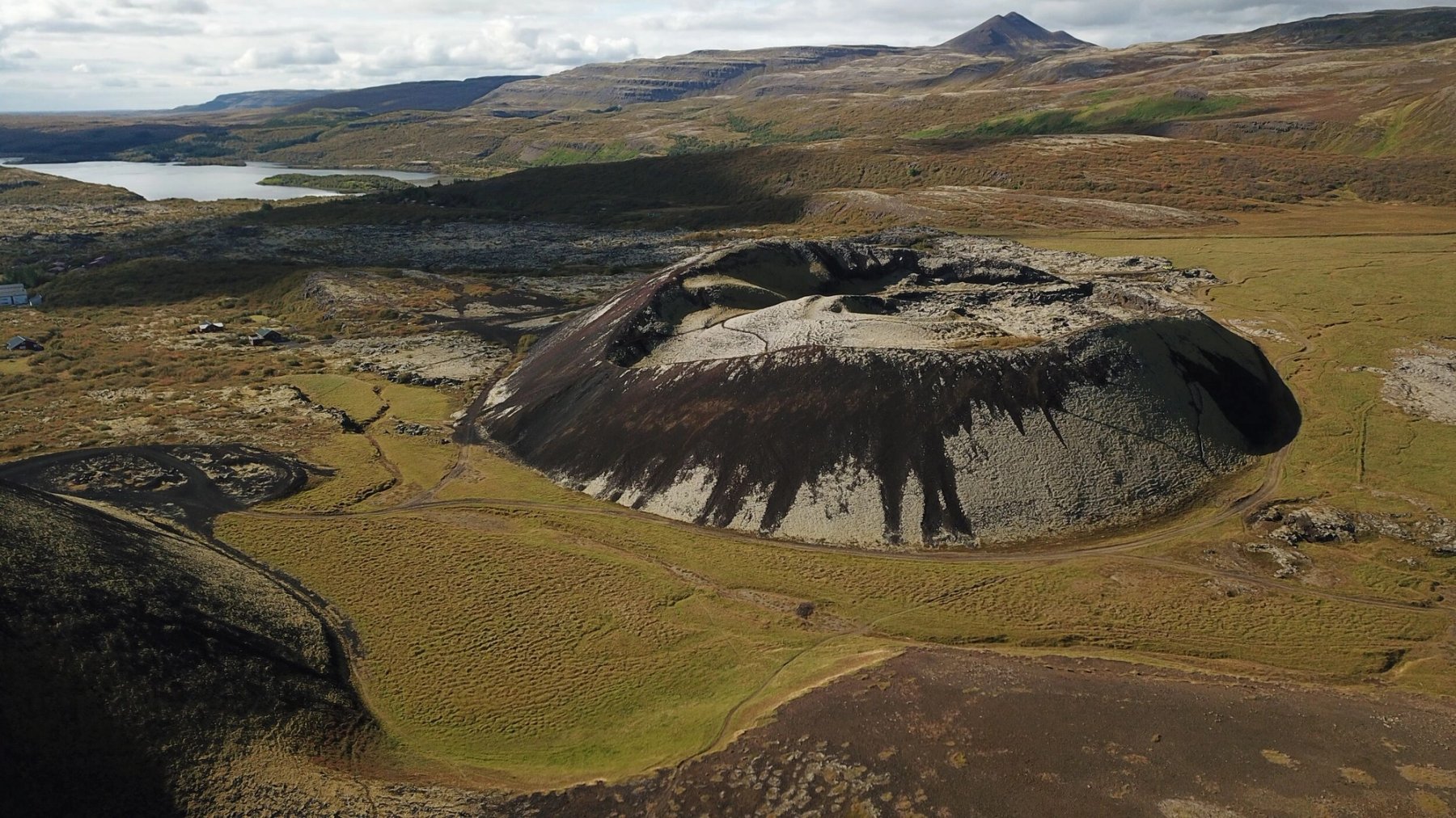 Aerial view of Grábrók crater and surrounding lava fields near Bifröst in West Iceland.