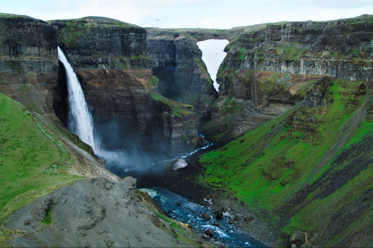 Granni waterfall running down the right side of the canyon beside Háifoss in Þjórsárdalur.