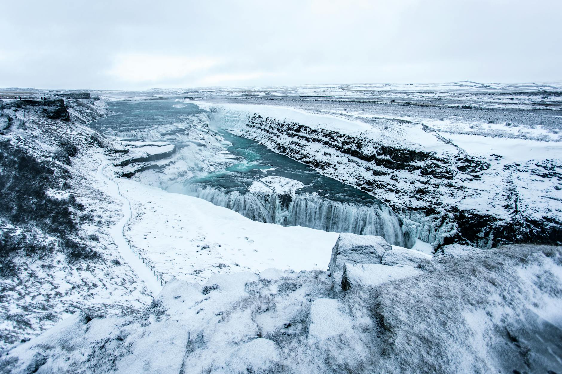 Snowy Gullfoss viewpoint with the Hvítá river dropping through the canyon.