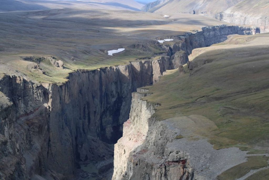 Steep rock walls of Hafrahvammagljufur Canyon in the East Iceland highlands.