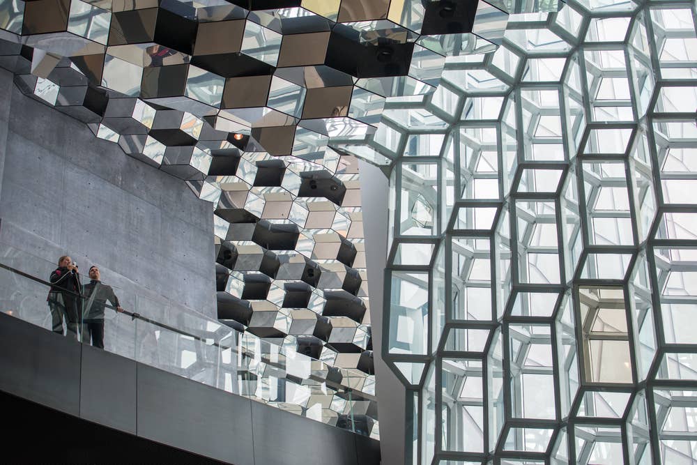 Interior glass and mirrored ceiling details inside Harpa Concert Hall in Reykjavík