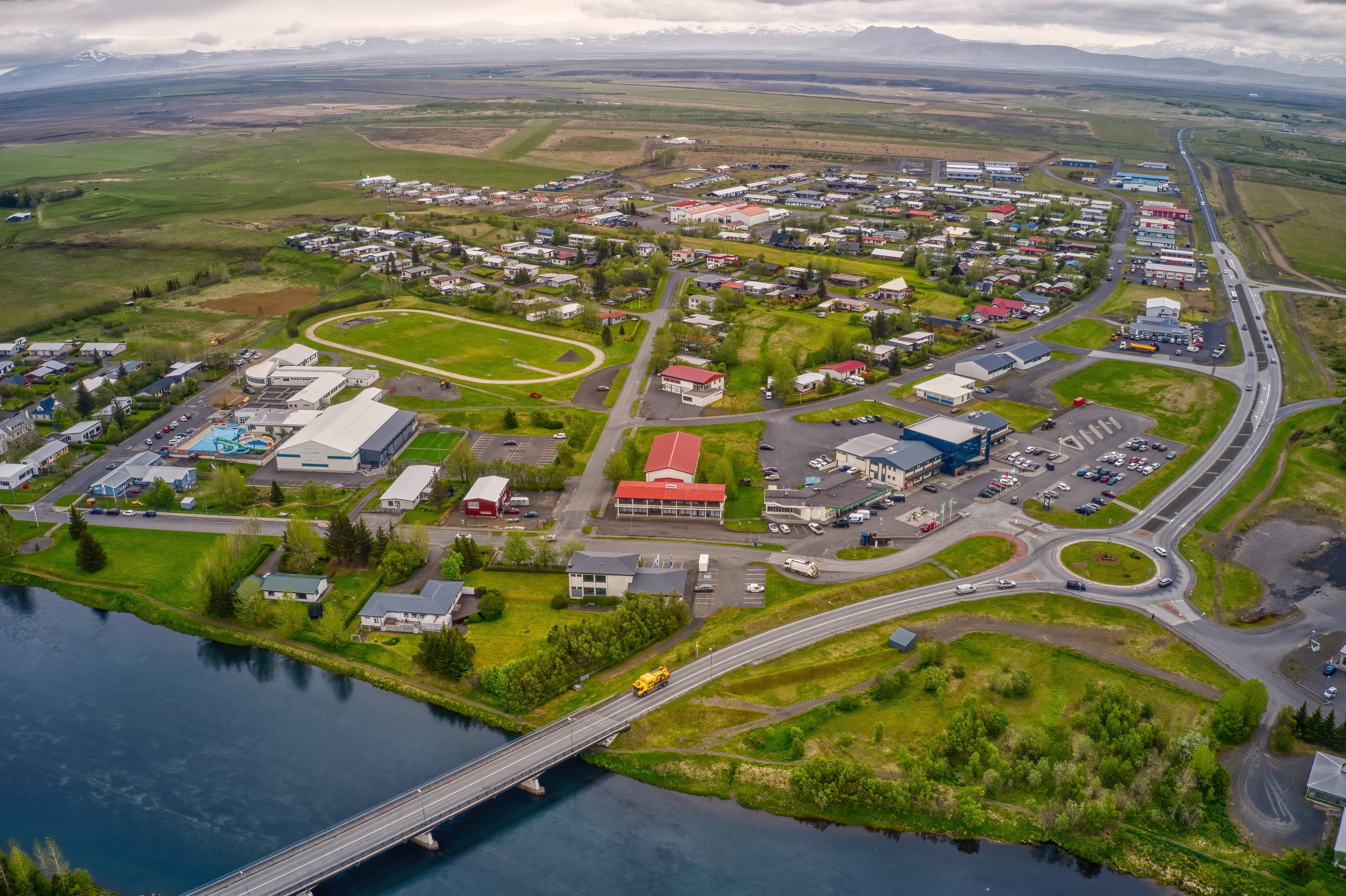 Aerial view of Hella beside Ytri-Rangá and the Route 1 bridge in South Iceland.