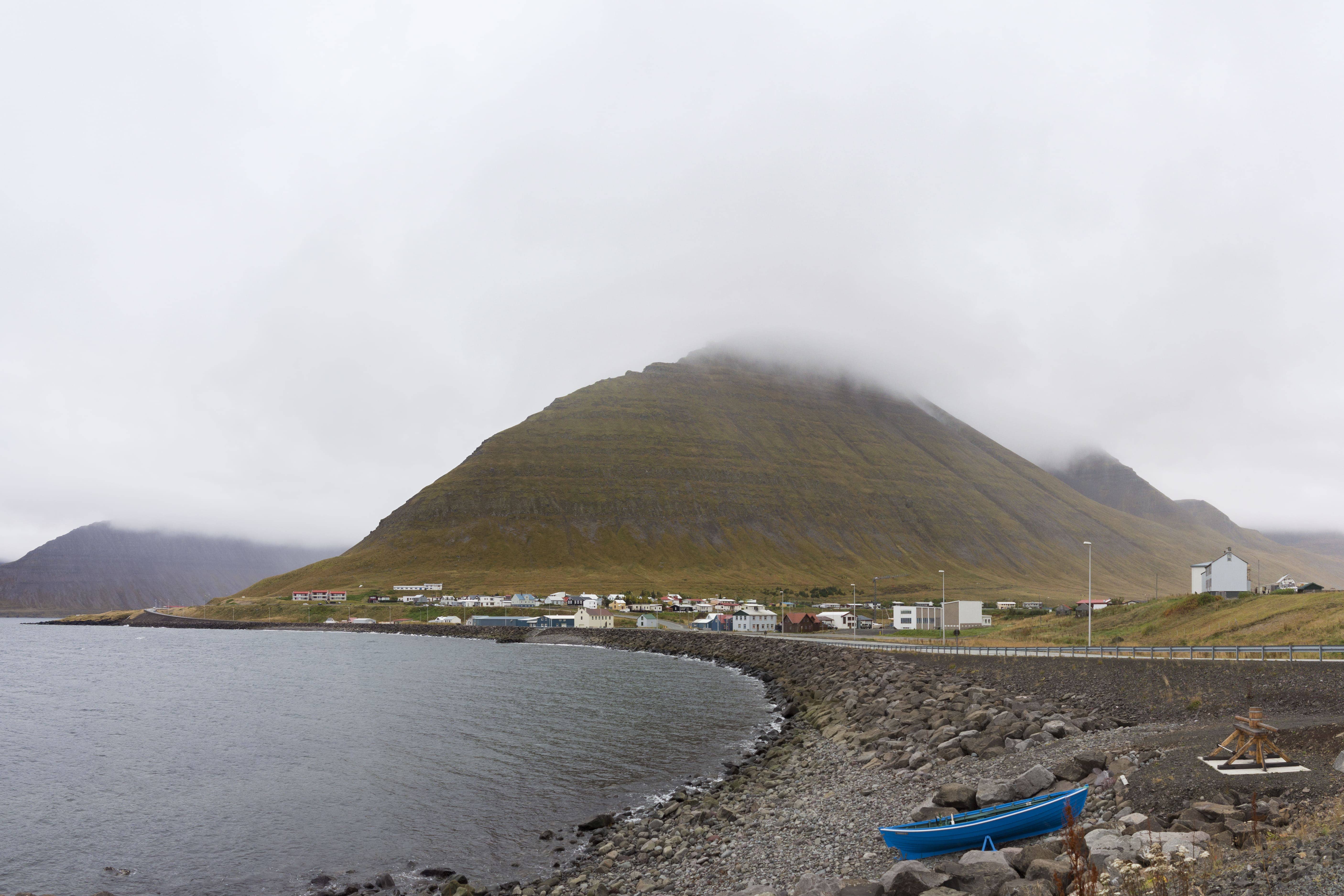 Hnífsdalur village on the Westfjords coast below steep mountain walls.