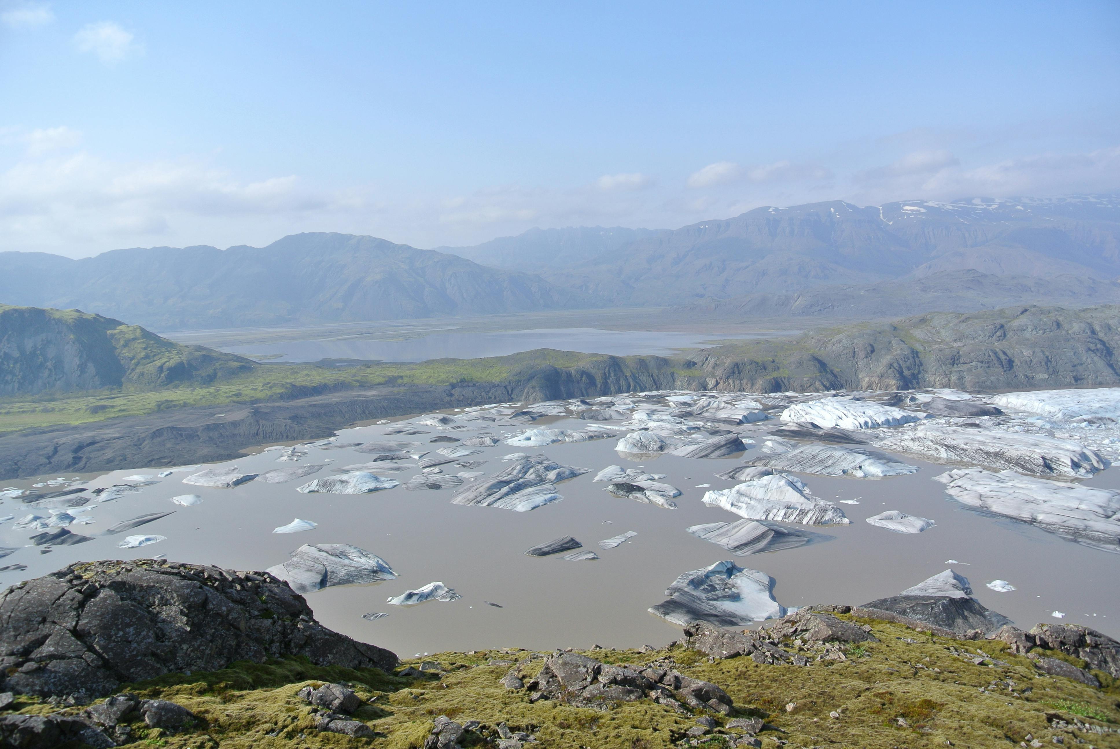 Hoffellslón and Hoffellsjökull beneath broad mountain slopes in southeast Iceland.