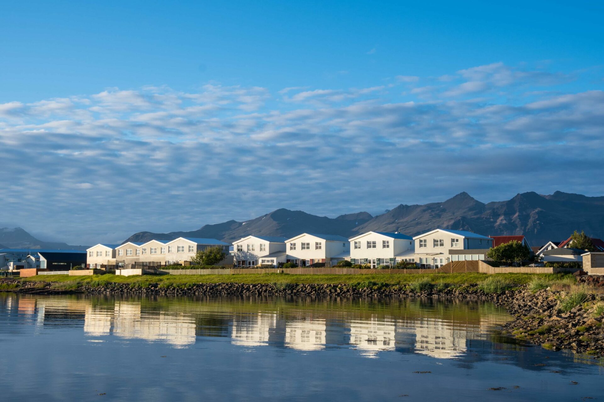 Höfn waterfront buildings with mountains behind the town in Hornafjörður.