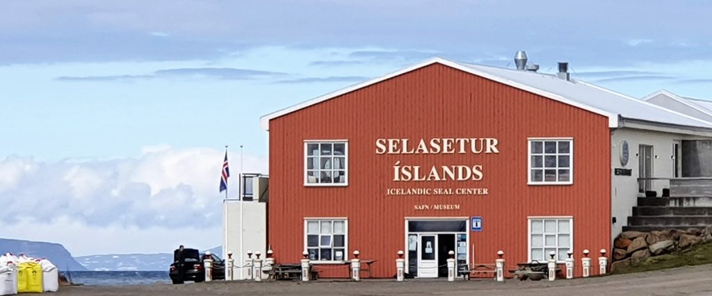 Red Icelandic Seal Center building on the harborfront in Hvammstangi