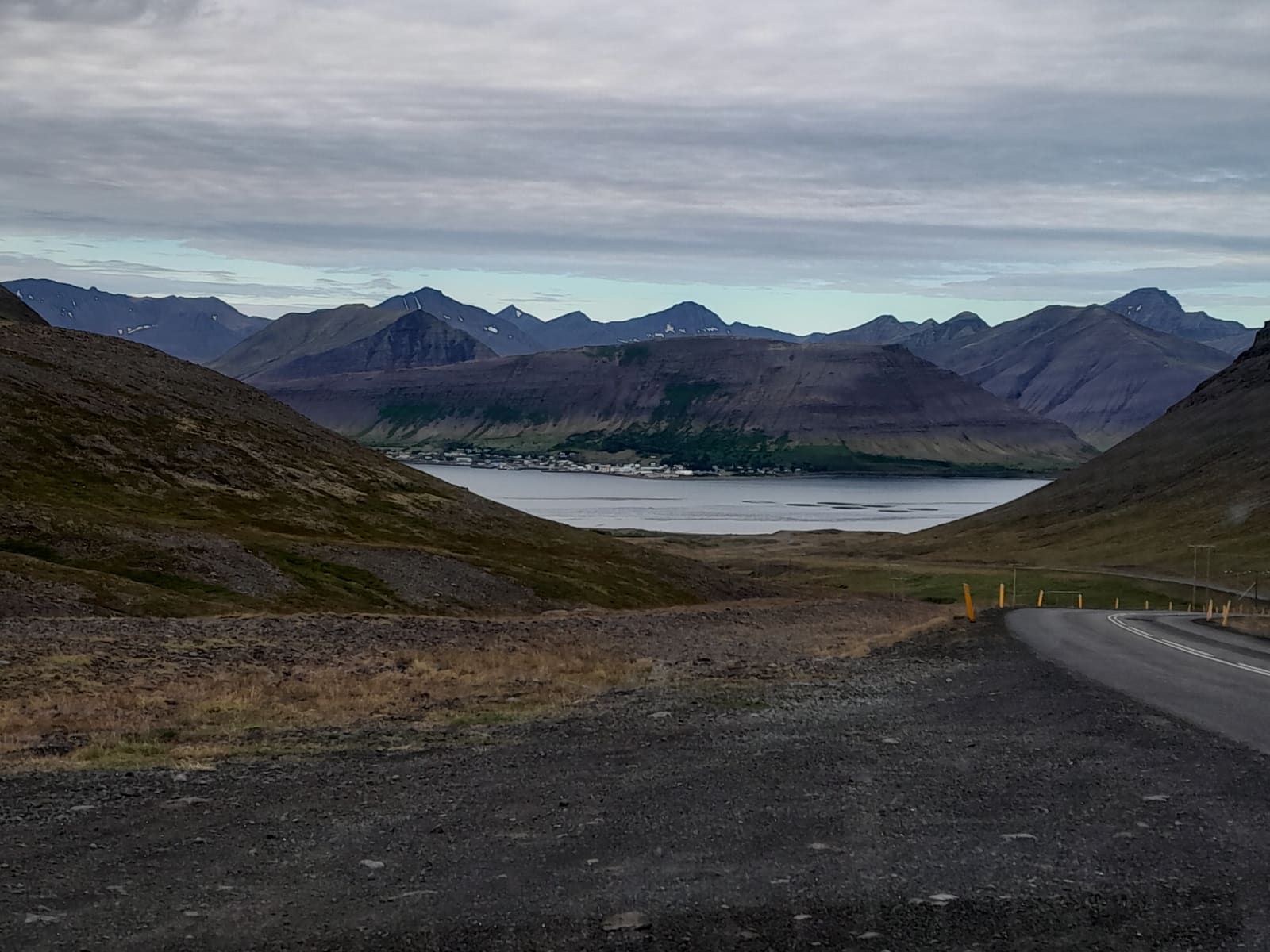 Road above Þingeyri with Dýrafjörður and Westfjords mountain ridges near Kaldbakur.