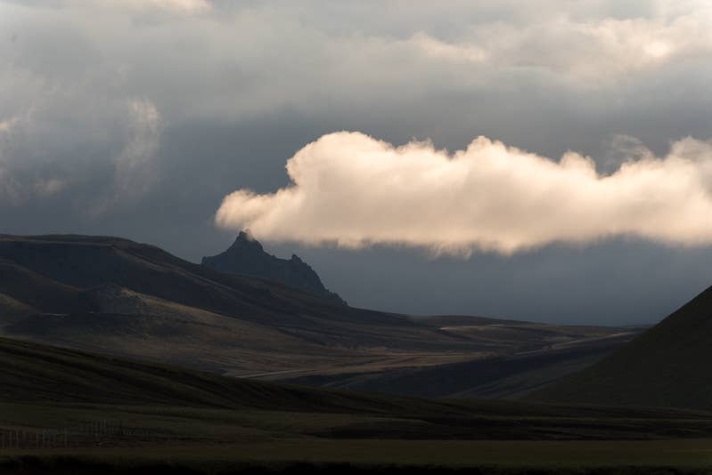 Krakatindur's dark jagged peak partly hidden by low cloud in the southern Highlands.
