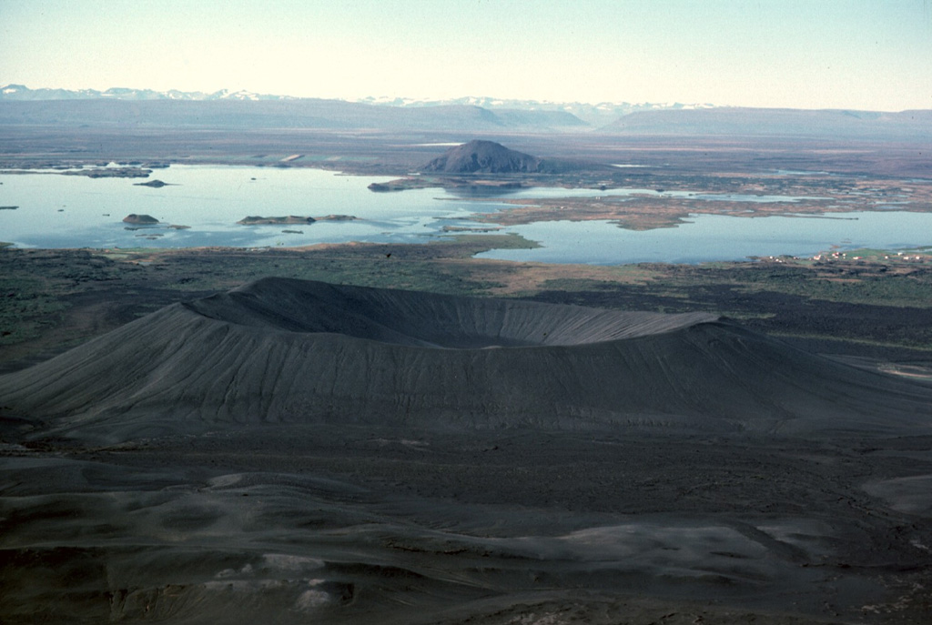 Hverfjall crater in front of Lake Mývatn with the Heiðarsporðar volcanic landscape around it.