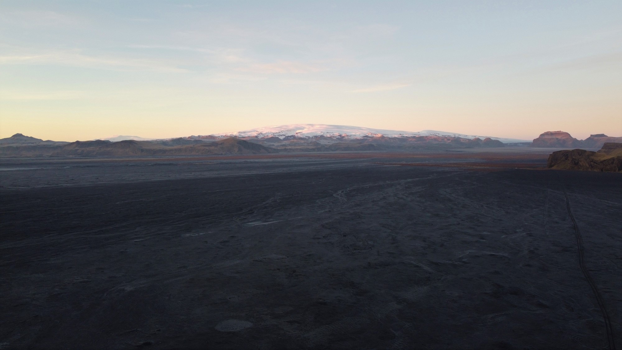 Wide black Mýrdalssandur outwash plain below Mýrdalsjökull and Hjörleifshöfði on Iceland’s South Coast.