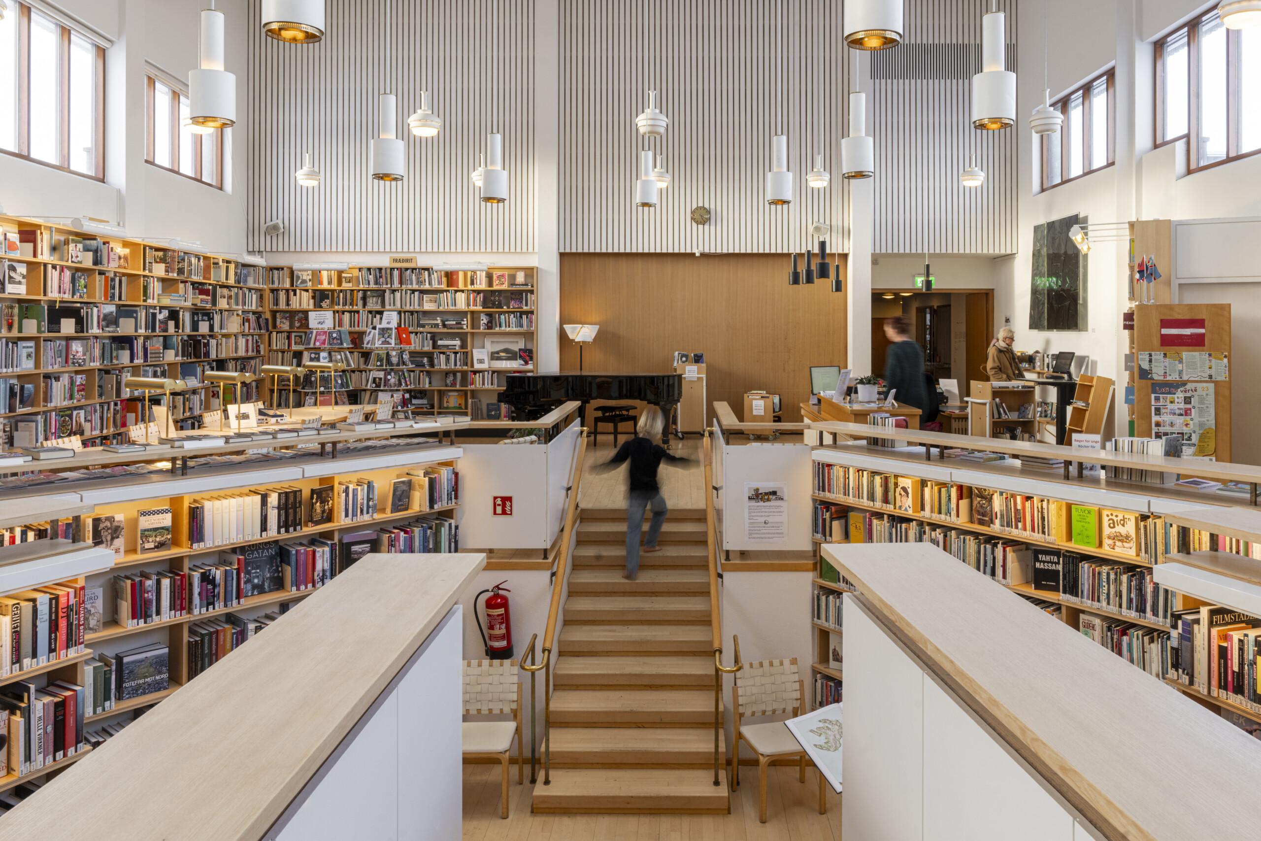 Central stair and reading areas inside the Nordic House library in Reykjavik.