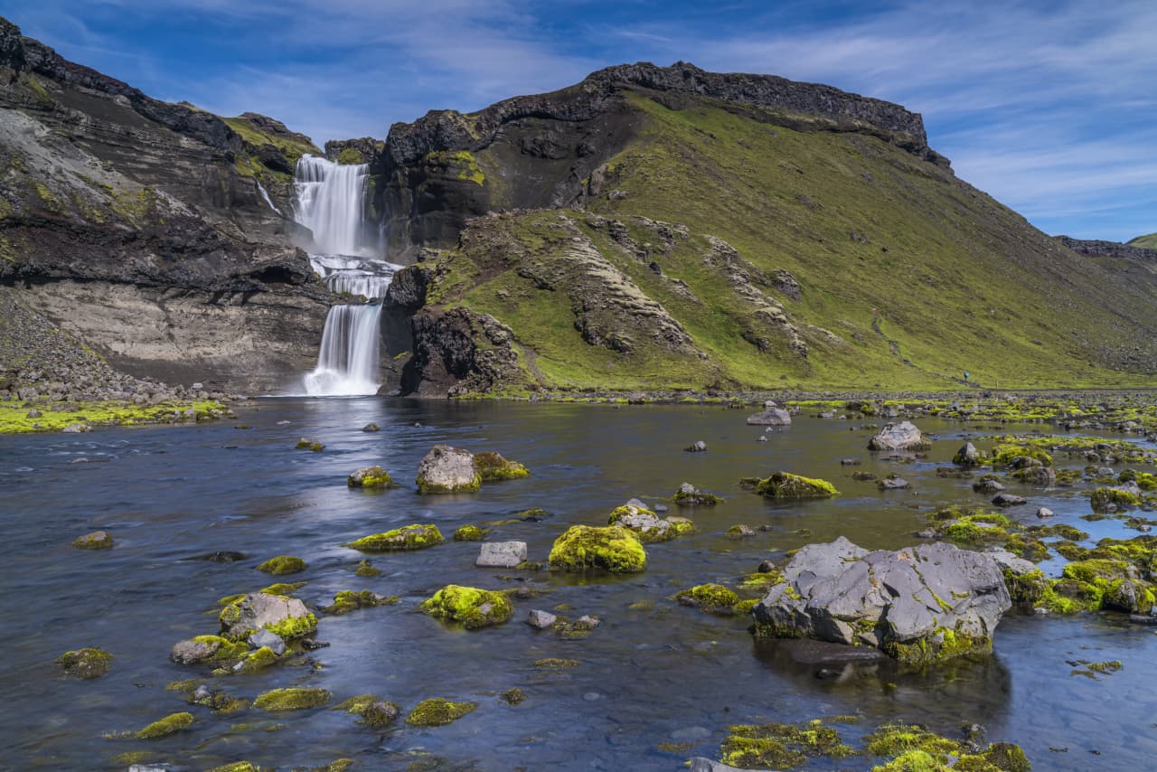 Ófærufoss waterfall dropping in two steps into the rocky Eldgjá canyon.