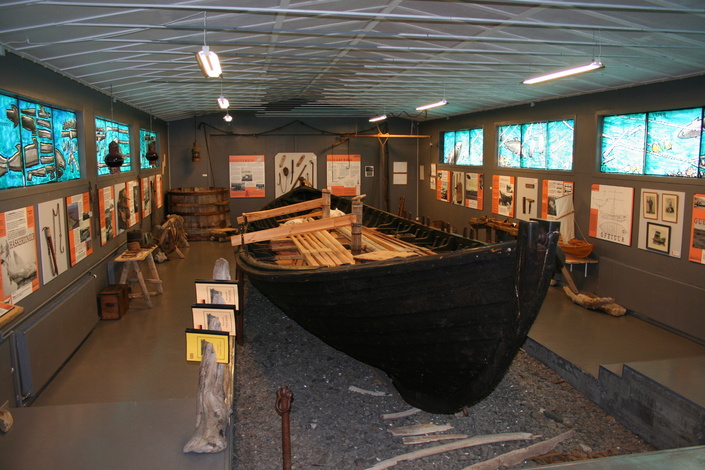 The Ófeigur shark-fishing boat displayed in the main hall of Reykir Regional Museum in Hrútafjörður.