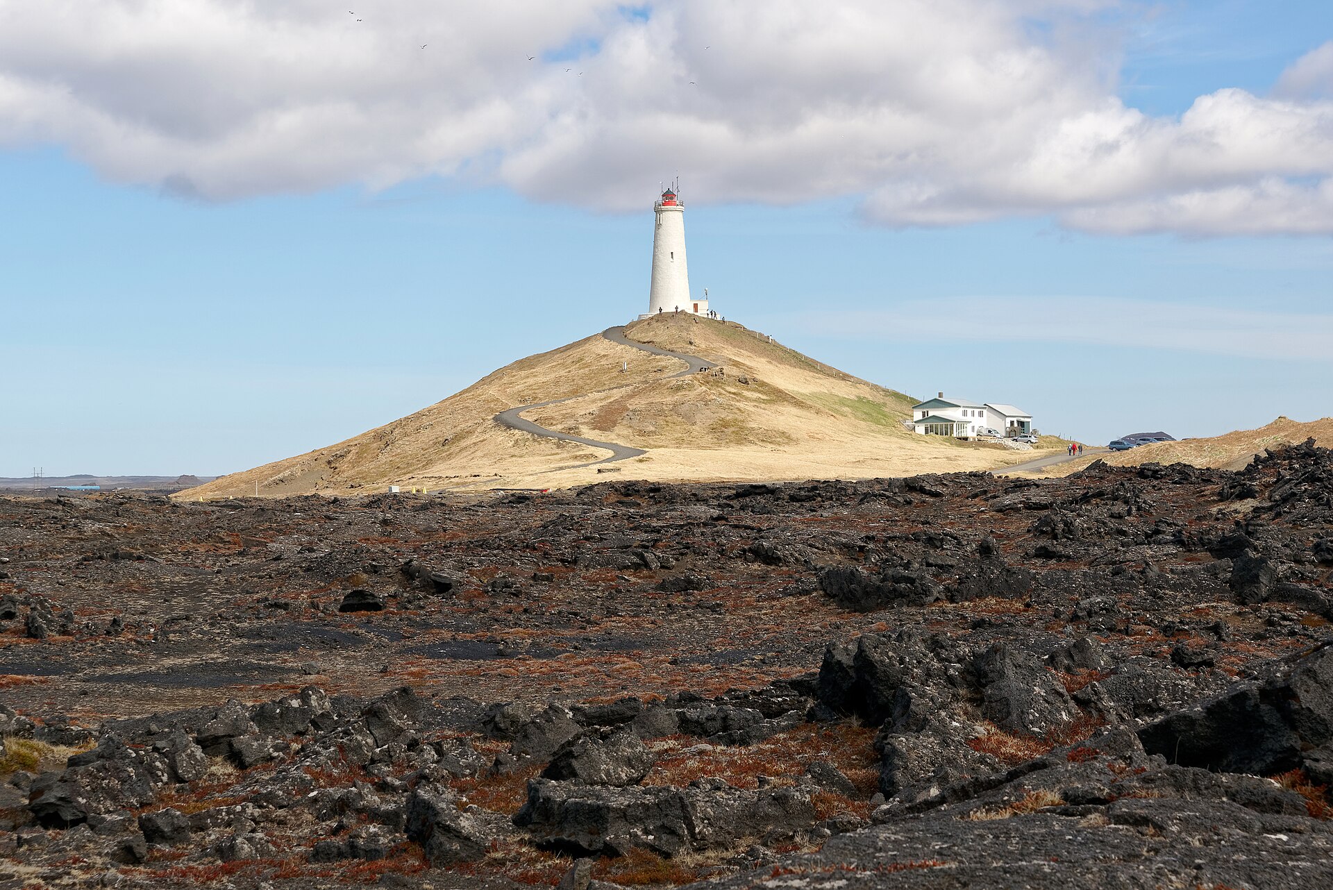 Reykjanesviti Lighthouse on Bæjarfell hill above dark lava fields on the Reykjanes Peninsula.