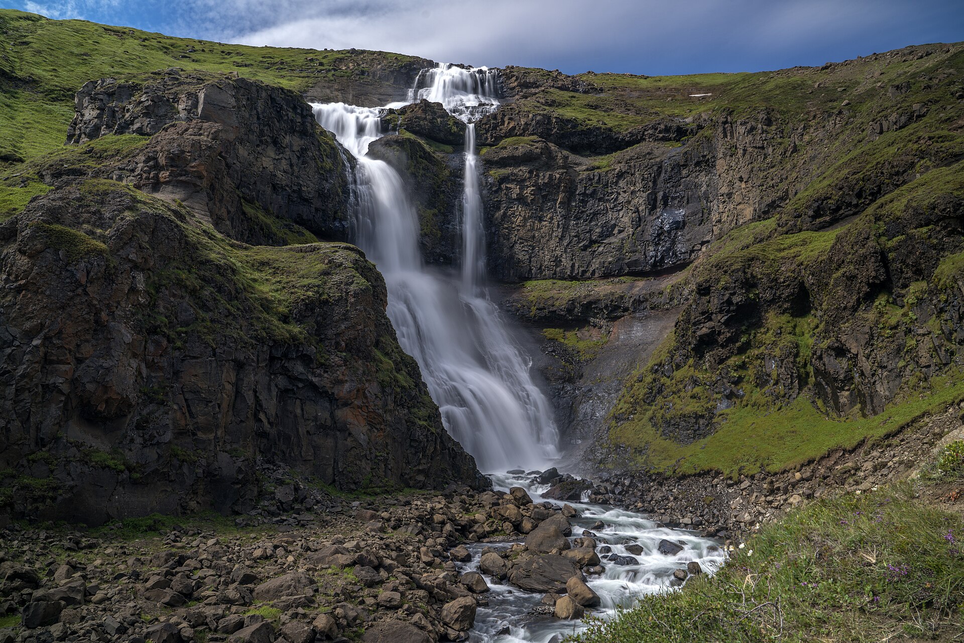 Rjúkandi Waterfall dropping in tiers down the Jökuldalur mountainside in East Iceland.