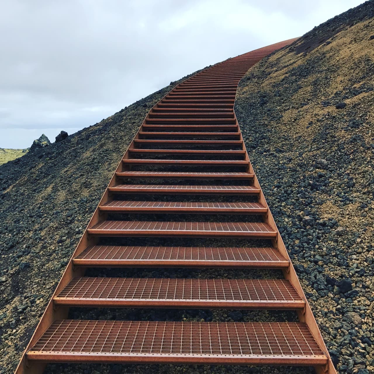 Metal stairs climbing Saxhóll crater on the Snæfellsnes Peninsula.