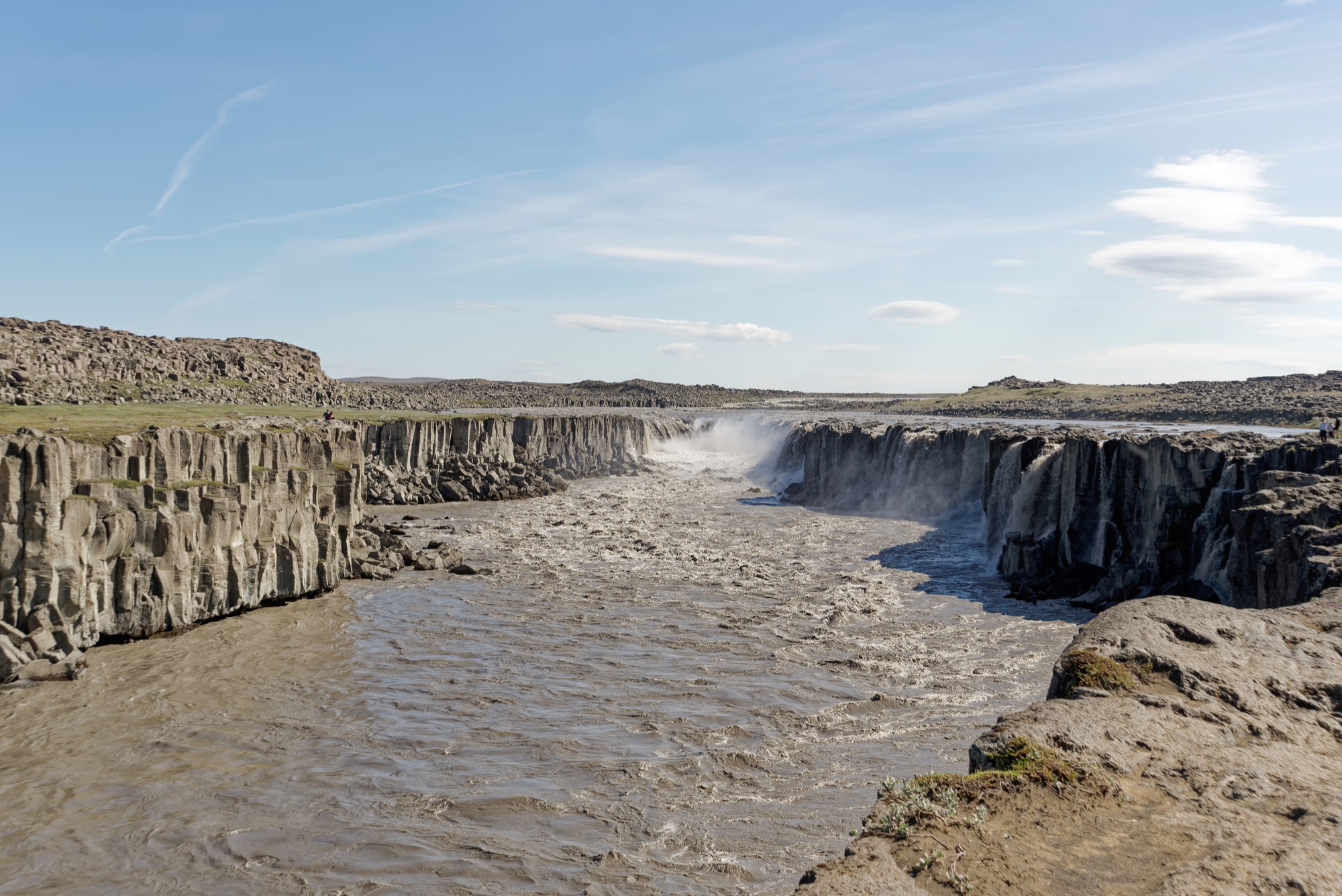 Selfoss Waterfall spreading across basalt cliffs above the glacial river Jökulsá á Fjöllum.
