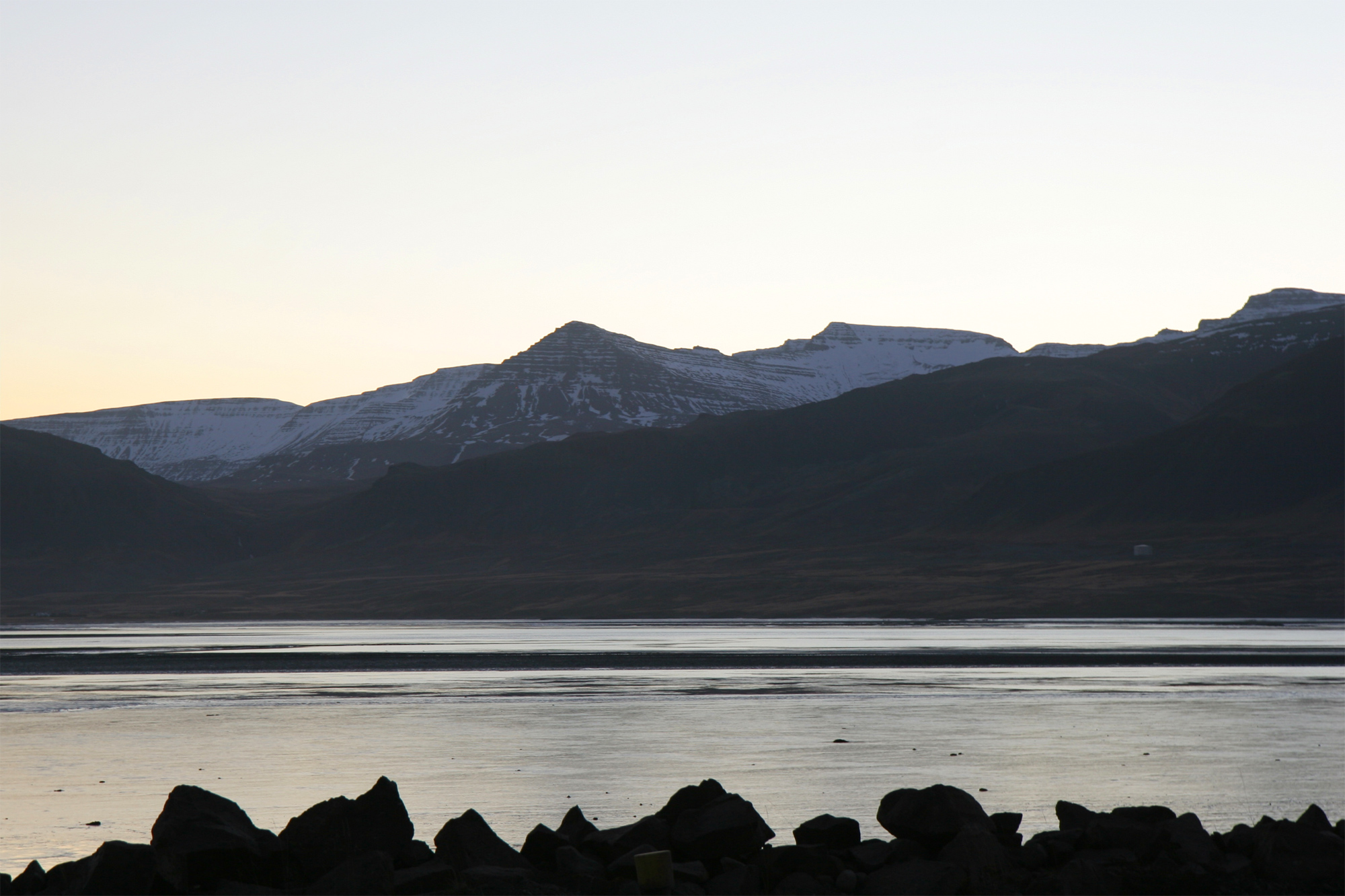 Skarðsheiði seen from Borgarnes across low West Iceland landscape.