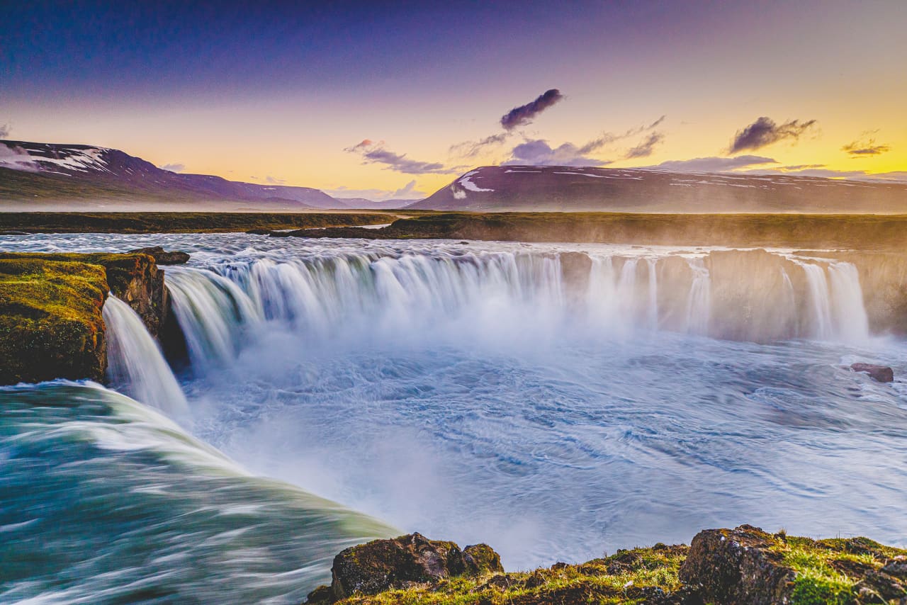Goðafoss on the Skjálfandafljót river under warm low light in North Iceland.