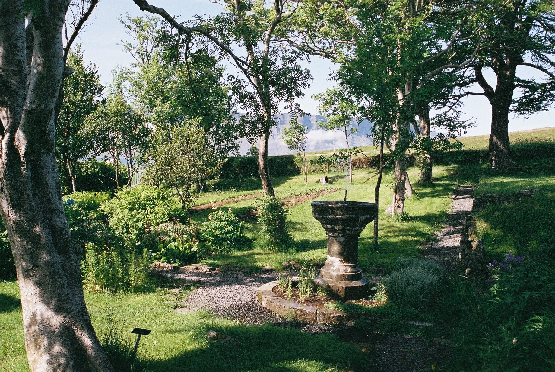 Whale jaw bones forming the entrance arch at Skrúður Botanical Garden in Dýrafjörður.